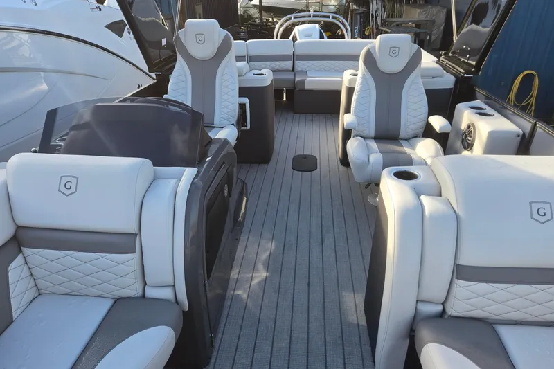 Slide: The Image of Luxurious interior of 2026 Godfrey Monaco 235 ULC pontoon boat with plush seating. - 8
