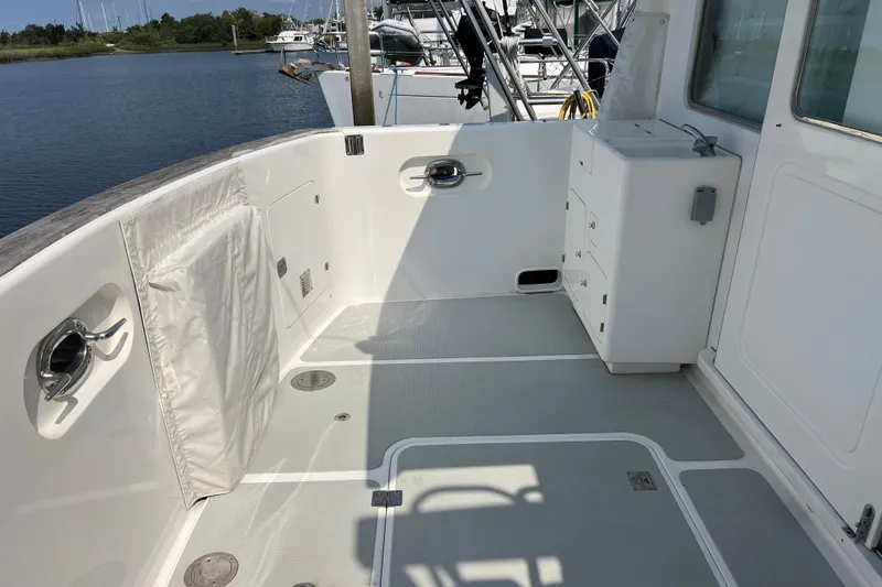 Slide: The Image of 2002 Nordhavn 50 yacht deck with storage and clean white finish. - 20