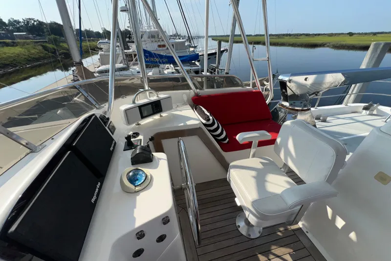 Slide: The Image of Helm of 2002 Nordhavn 50 yacht with seating and navigation equipment. - 24