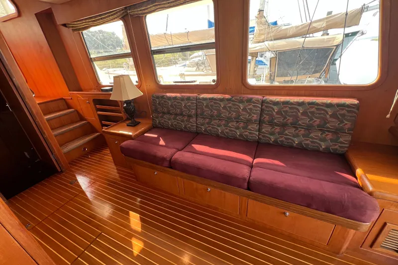 Slide: The Image of Luxurious 2002 Nordhavn 50 yacht interior with plush seating and elegant wood finishes. - 3