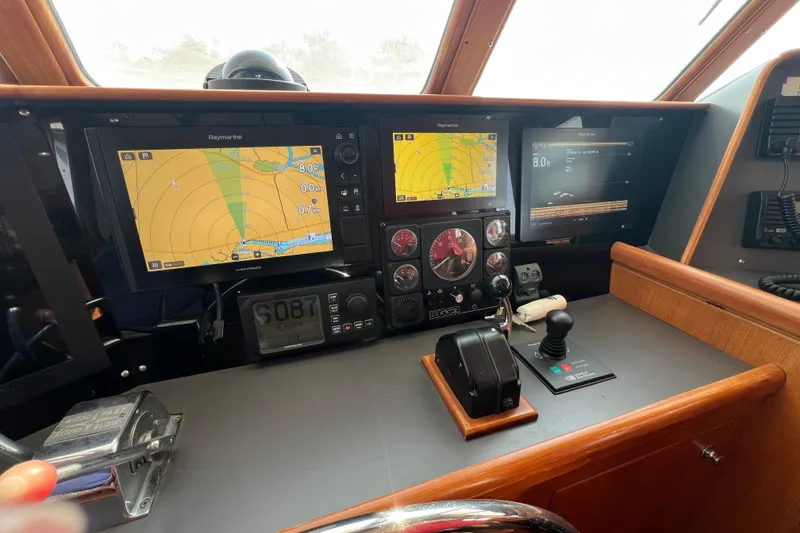 Slide: The Image of Cockpit of 2002 Nordhavn 50 yacht with navigation equipment and controls. - 7