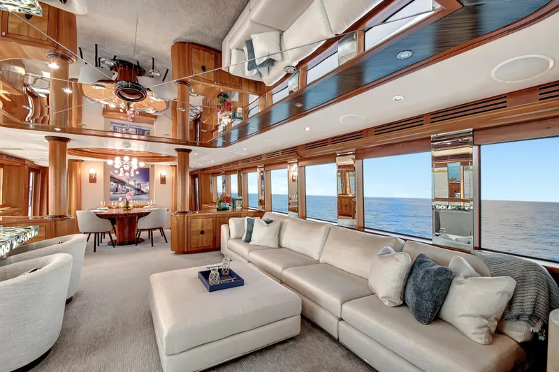 Slide: The Image of Luxurious interior of 2005 Hatteras 100 Motor Yacht with elegant seating and ocean view. - 11