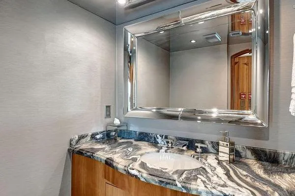 Slide: The Image of Luxurious bathroom in 2005 Hatteras 100 Motor Yacht with elegant marble countertop. - 20