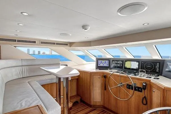 Slide: The Image of Interior helm of 2005 Hatteras 100 Motor Yacht with modern navigation equipment and panoramic windows. - 21