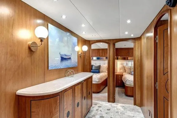 Slide: The Image of Luxurious interior of 2005 Hatteras 100 Motor Yacht with elegant wood paneling and cozy bedrooms. - 24