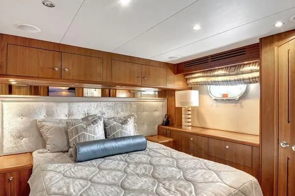 Slide: The Image of Luxurious bedroom interior of 2005 Hatteras 100 Motor Yacht with elegant wood finishes. - 35