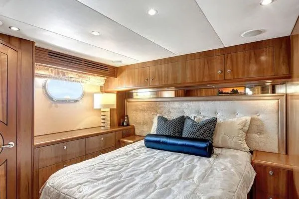 Slide: The Image of Luxurious bedroom interior of 2005 Hatteras 100 Motor Yacht with elegant wood finish. - 37