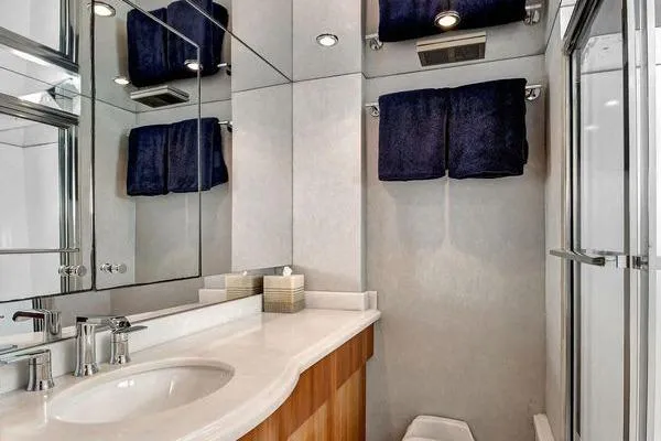 Slide: The Image of Luxurious bathroom in 2005 Hatteras 100 Motor Yacht with modern fixtures and elegant design. - 38