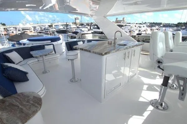 Slide: The Image of Luxurious 2005 Hatteras 100 Motor Yacht deck with seating and bar area. - 45