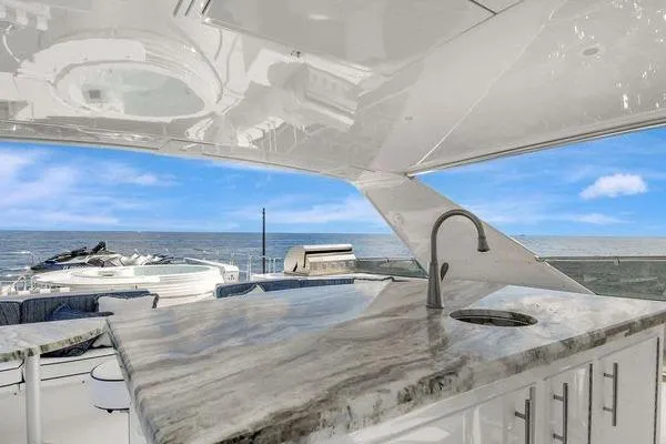 Slide: The Image of Luxurious 2005 Hatteras 100 Motor Yacht with elegant outdoor kitchen and ocean view. - 51