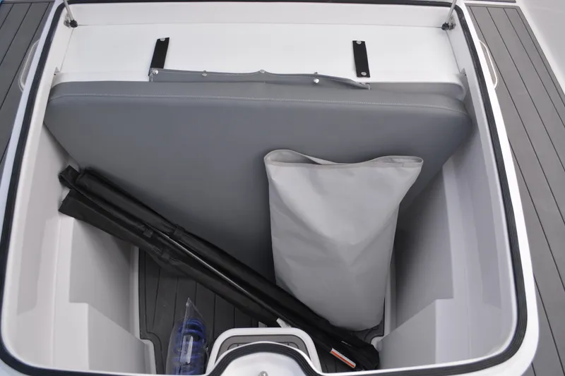 Slide: The Image of 2026 NauticStar 332 Offshore boat interior with seating and storage compartments. - 12