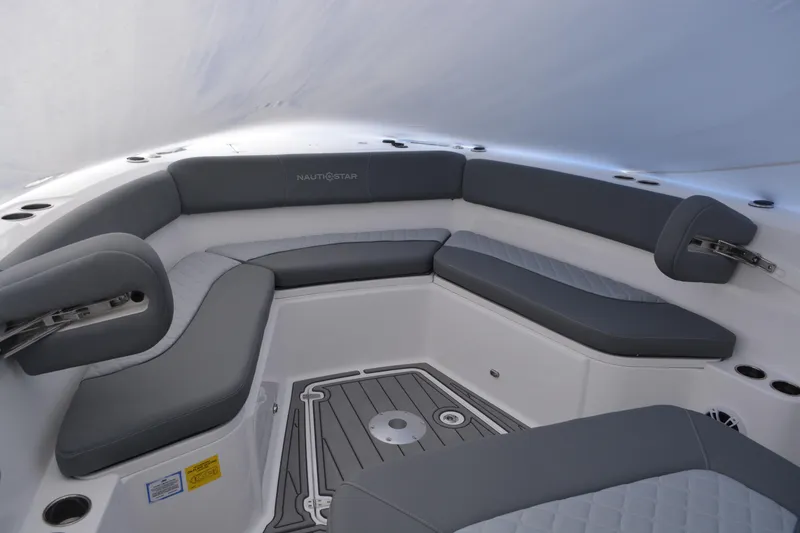Slide: The Image of 2026 NauticStar 332 Offshore boat interior with open storage compartment. - 14