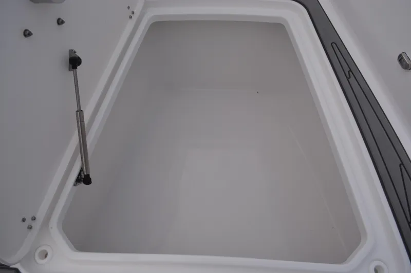 Slide: The Image of 2026 NauticStar 332 Offshore boat interior with gray cushioned seating. - 17