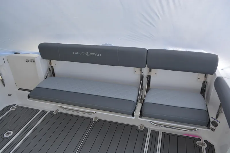 Slide: The Image of Storage compartment of 2026 NauticStar 332 Offshore boat, featuring a hydraulic lift. - 20