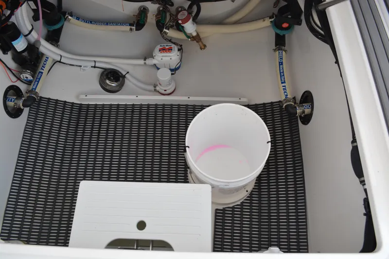 Slide: The Image of 2026 NauticStar 332 Offshore boat seating with gray cushions and sleek design. - 23