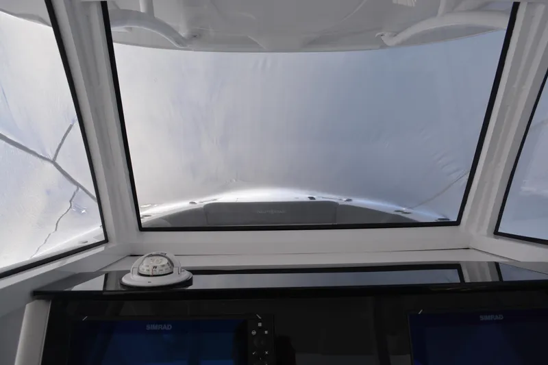 Slide: The Image of Interior view of 2026 NauticStar 332 Offshore boat with equipment and bucket. - 26