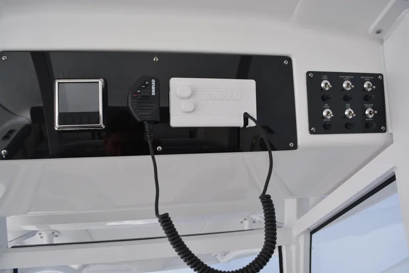 Slide: The Image of 2026 NauticStar 332 Offshore helm with modern controls and dual screens. - 30