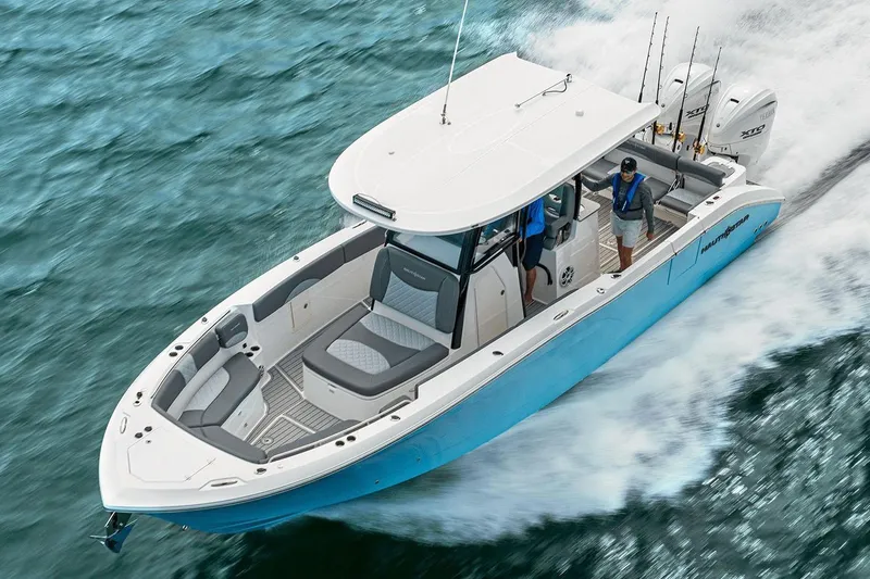 Slide: The Image of 2026 NauticStar 332 Offshore boat bathroom with sink, toilet, and control panel. - 38