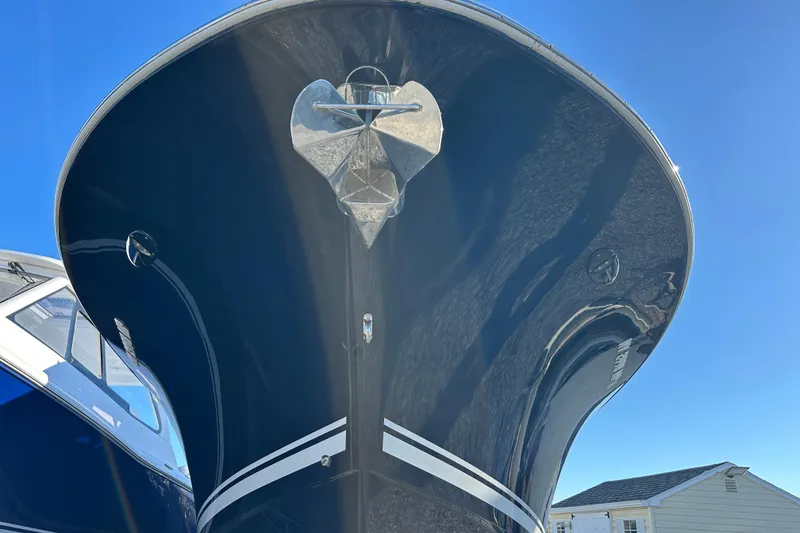 Slide: The Image of 2020 Southport 33DC boat bow with anchor against clear blue sky. - 2