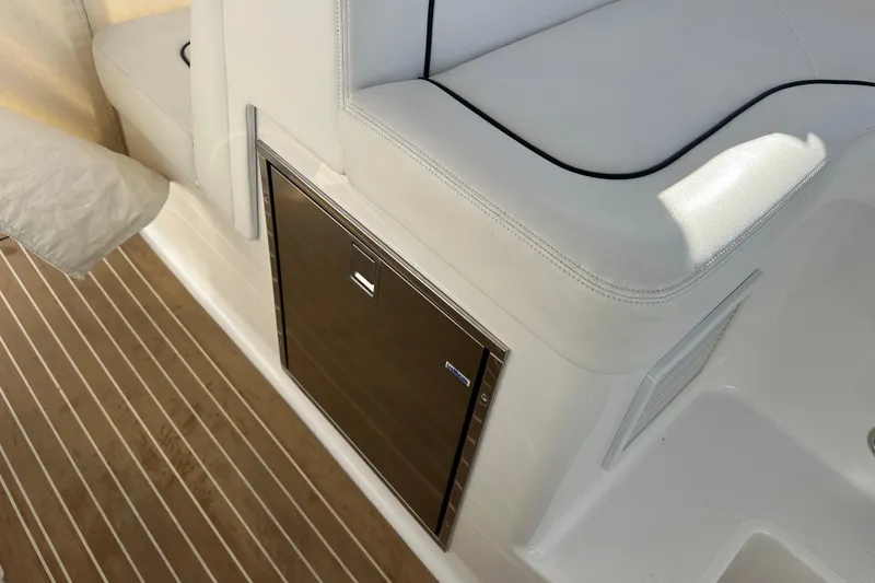 Slide: The Image of Luxury seating and storage on 2020 Southport 33DC boat with teak flooring. - 20