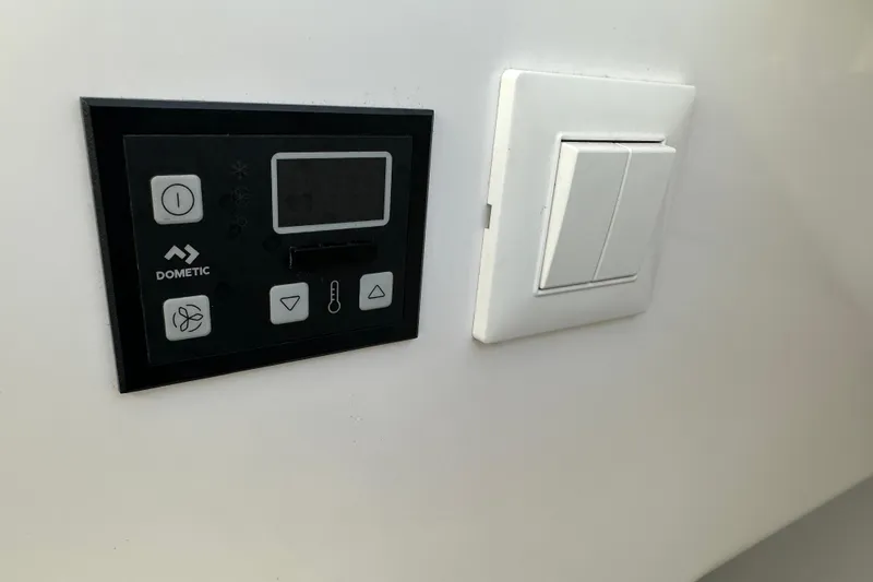 Slide: The Image of Dometic control panel and light switch on Southport 33DC, 2020 model. - 26