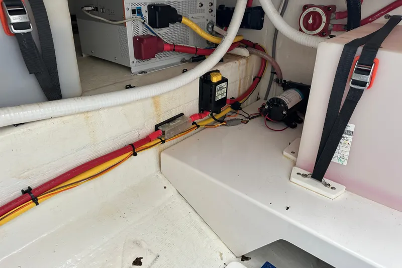 Slide: The Image of 2020 Southport 33DC boat interior wiring and components, featuring cables and equipment. - 30