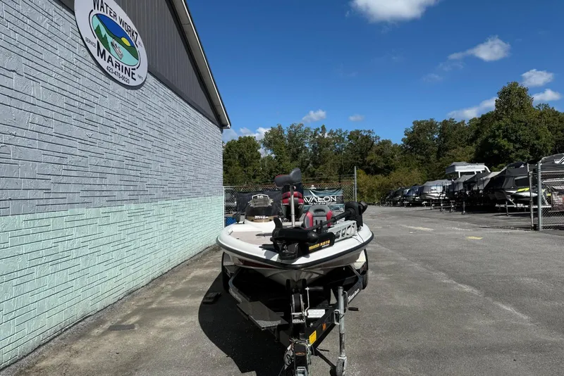 Slide: The Image of 2000 Triton TR21DC boat parked outside Water Works Marine building. - 3