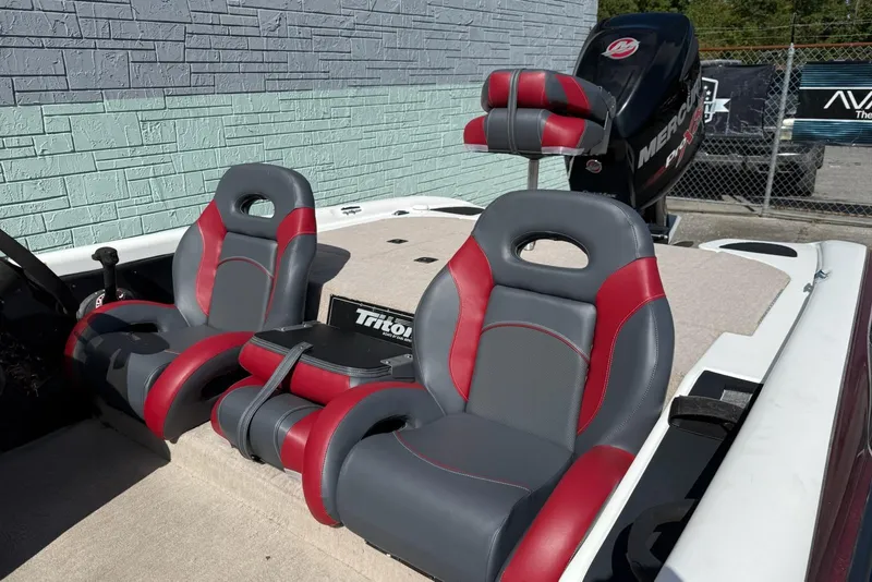 Slide: The Image of 2000 Triton TR21DC boat interior with red and gray seats, Mercury Pro XS engine. - 8
