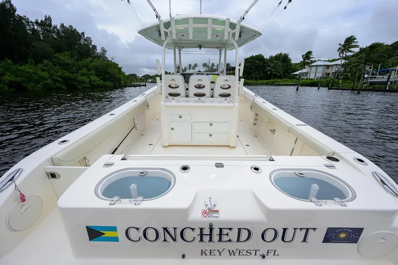 Slide: The Image of 2020 Cobia 350 CC boat named "Conched Out" docked in Key West, Florida. - 28