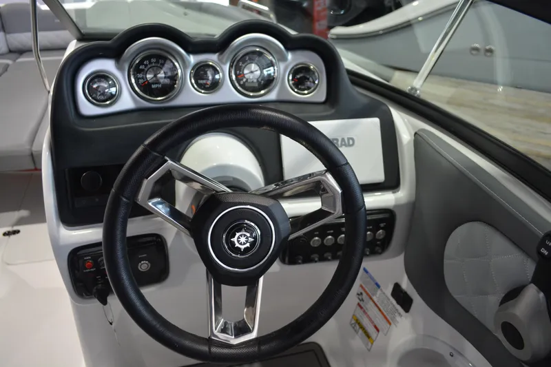 Slide: The Image of Steering wheel and dashboard of 2026 NauticStar 243 DC Deck boat. - 15