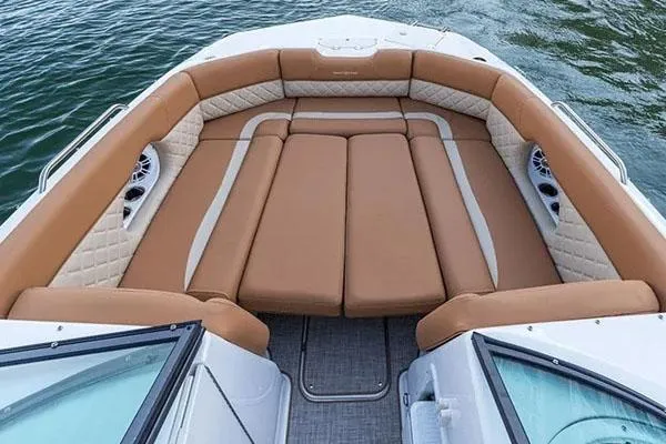 Slide: The Image of 2026 NauticStar 243 DC Deck boat with Yamaha engine in showroom. - 4