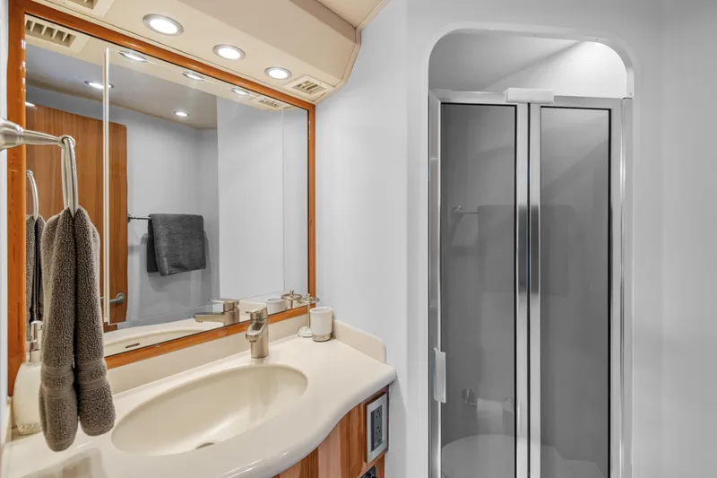 Slide: The Image of Luxurious bathroom in 2005 Viking 61 Convertible yacht with modern fixtures and shower. - 25