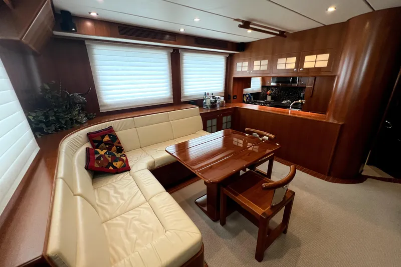 Slide: The Image of Luxurious interior of a 2011 Nordhavn 60 yacht with elegant wood finishes and cozy seating. - 10