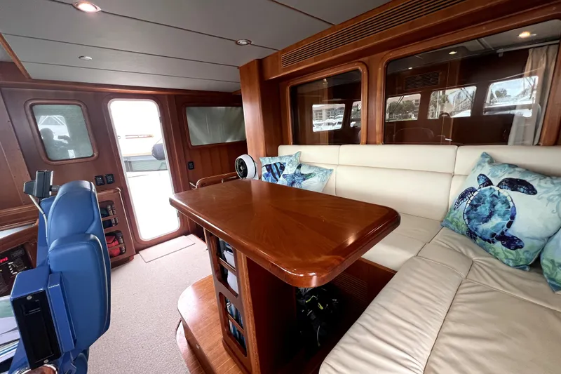 Slide: The Image of Luxurious 2011 Nordhavn 60 yacht interior with plush seating and nautical-themed decor. - 26