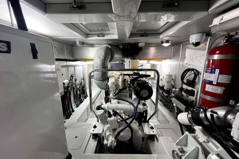 Slide: The Image of Engine room of a 2011 Nordhavn 60 yacht, featuring mechanical equipment and fire safety systems. - 30