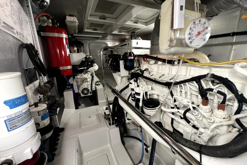 Slide: The Image of Engine room of a 2011 Nordhavn 60 yacht, featuring detailed mechanical components. - 31