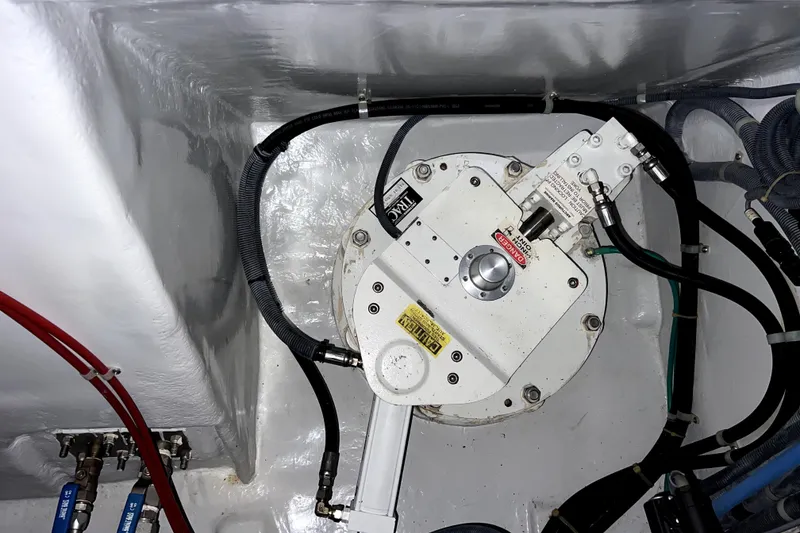 Slide: The Image of Engine room detail of a 2011 Nordhavn 60 yacht, showcasing mechanical components and wiring. - 35