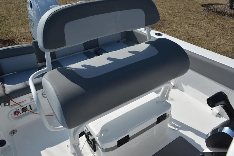 Slide: The Image of 2026 NauticStar 212 Legacy boat interior with cushioned seating and storage. - 14