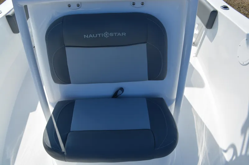 Slide: The Image of 2026 NauticStar 212 Legacy boat seat with gray upholstery and logo. - 19