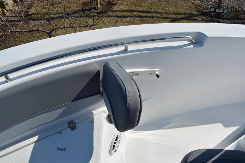 Slide: The Image of 2026 NauticStar 212 Legacy boat interior with cushioned seating and stainless steel railing. - 23