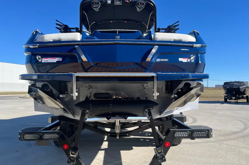 Slide: The Image of 2025 MasterCraft X24 boat rear view, showcasing sleek design and advanced features. - 4