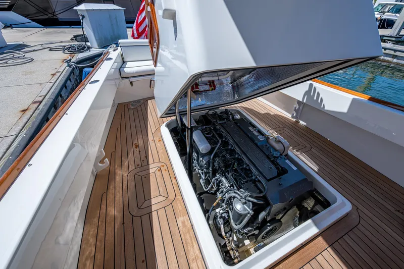 Slide: The Image of 2003 Hinckley Talaria 29 Center Console engine compartment with open hatch, dockside view. - 13