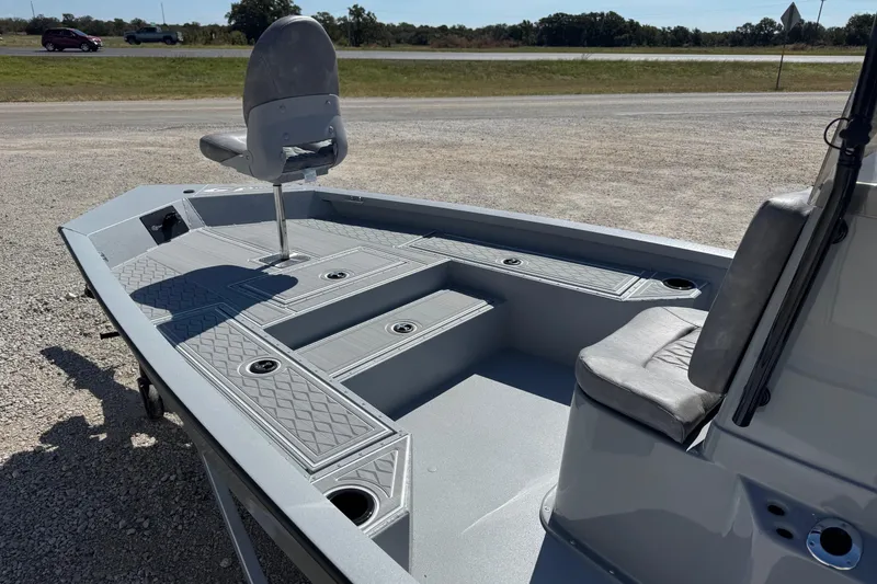 Slide: The Image of 2026 G3 21GX boat interior with seating and storage compartments. - 5