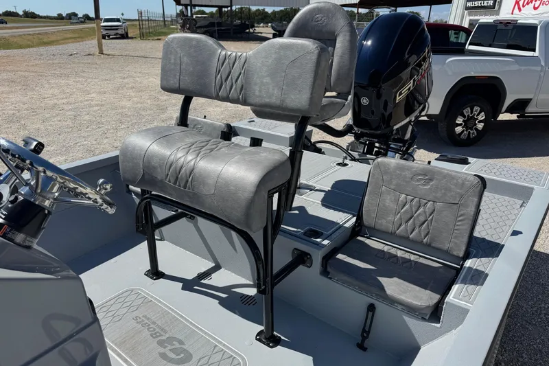 Slide: The Image of 2026 G3 21GX boat interior with gray seating and steering wheel. - 7