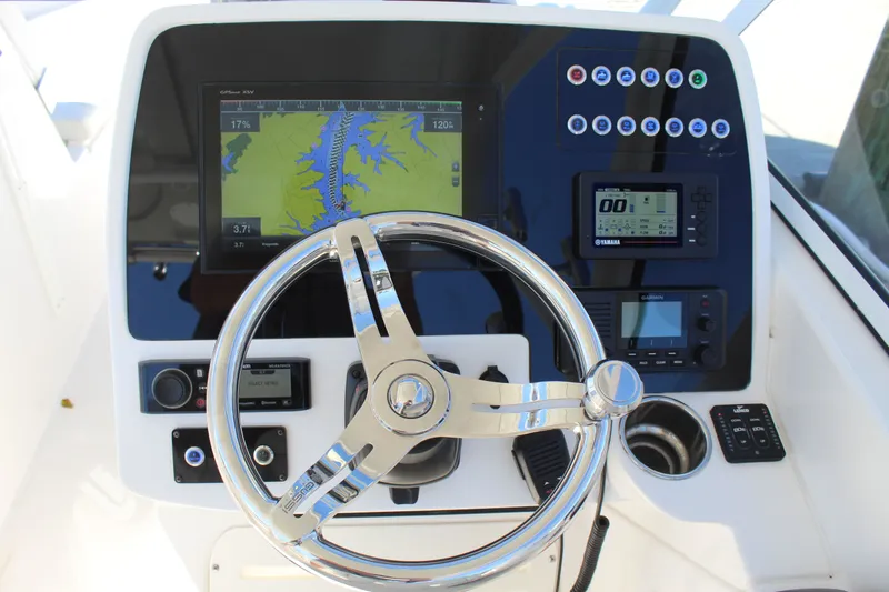 Slide: The Image of 2020 Edgewater 248CX Crossover helm with GPS display and controls. - 24