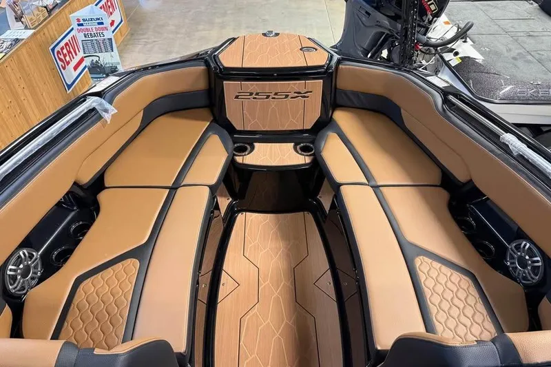 Slide: The Image of 2026 Yamaha Boats 255XD interior with tan seating and sleek design. - 11