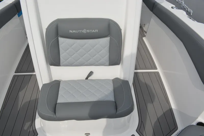 Slide: The Image of 2026 NauticStar 242 Offshore boat seat with gray quilted upholstery. - 13