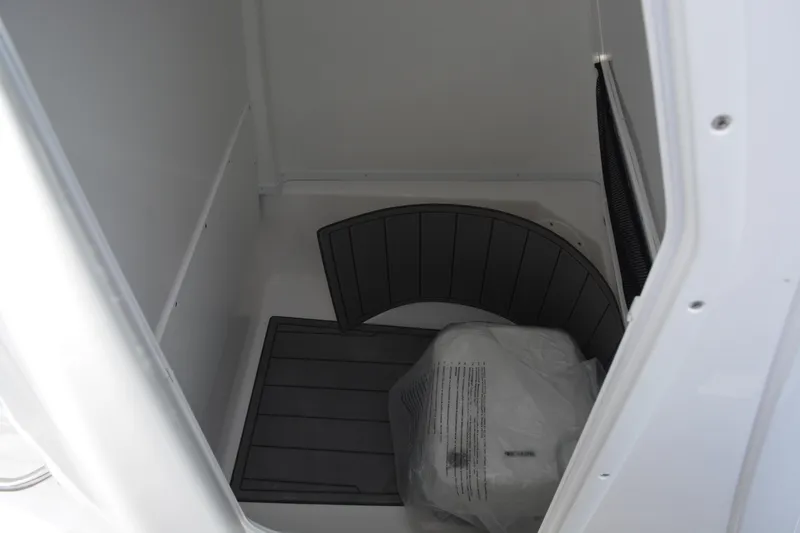Slide: The Image of Interior storage compartment of 2026 NauticStar 242 Offshore boat. - 14
