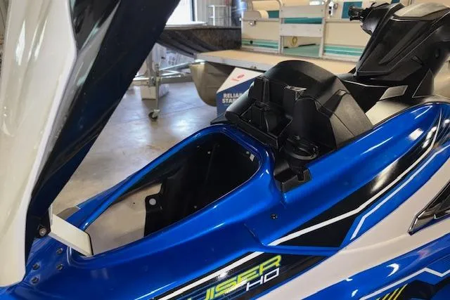 Slide: The Image of 2018 Yamaha WaveRunner VX Cruiser HO in a showroom, showcasing its sleek blue design. - 12