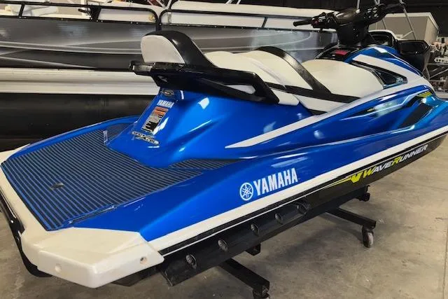 Slide: The Image of 2018 Yamaha WaveRunner VX Cruiser HO in blue, displayed indoors on a stand. - 4